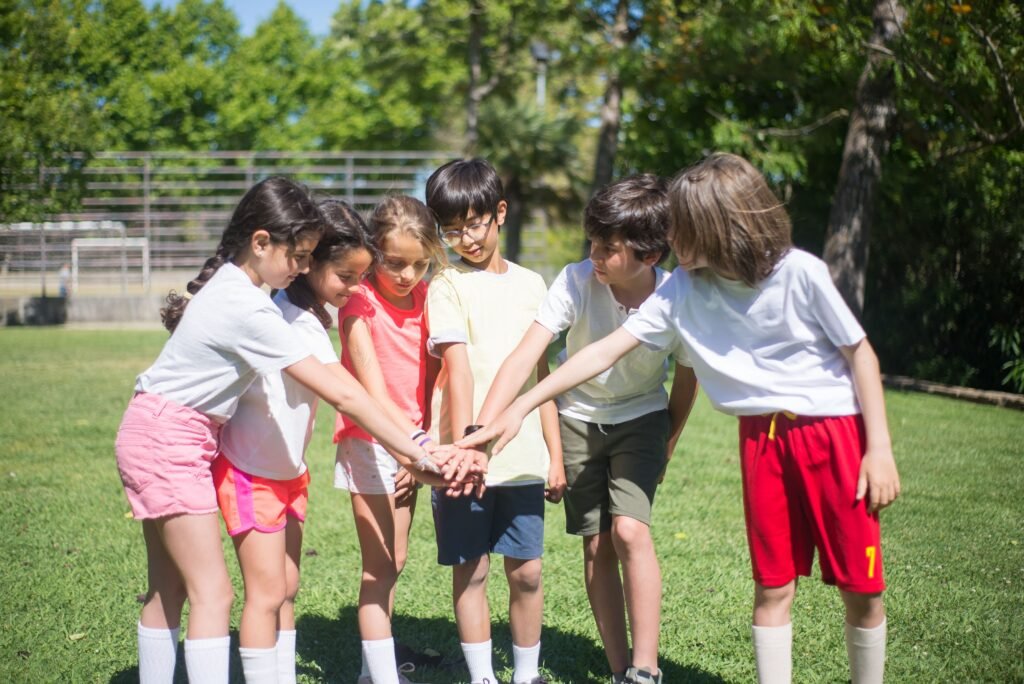 Young girls and boys in a soccer team huddle, fueled by sports nutrition for kids